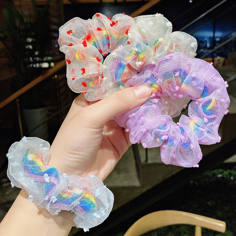 Red flowers around rainbow scrunchie