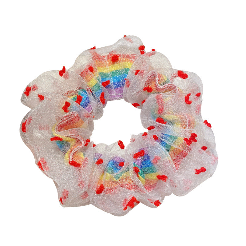 Red flowers around rainbow scrunchie