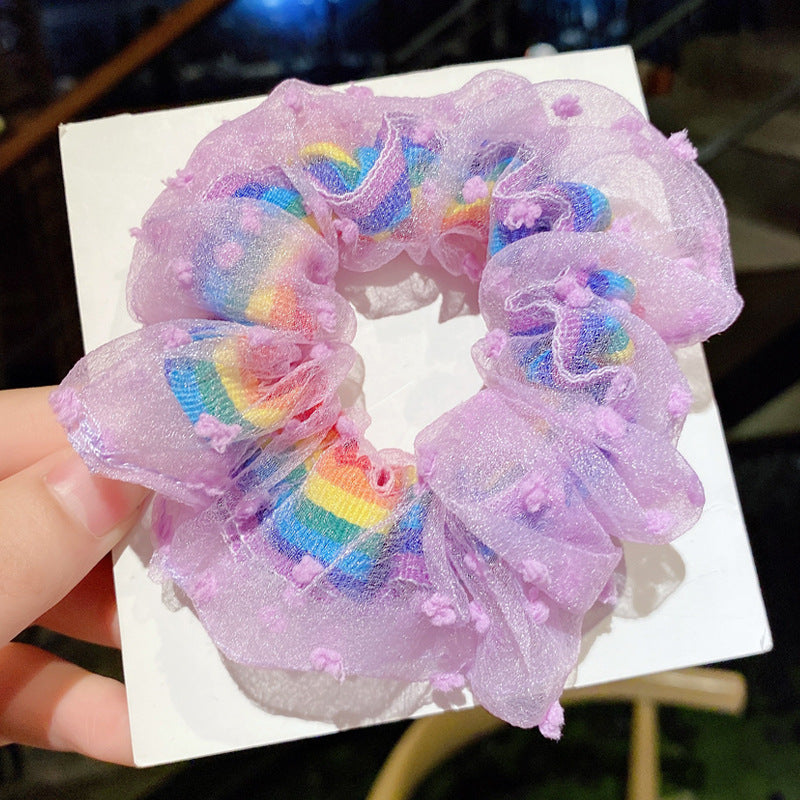 Red flowers around rainbow scrunchie